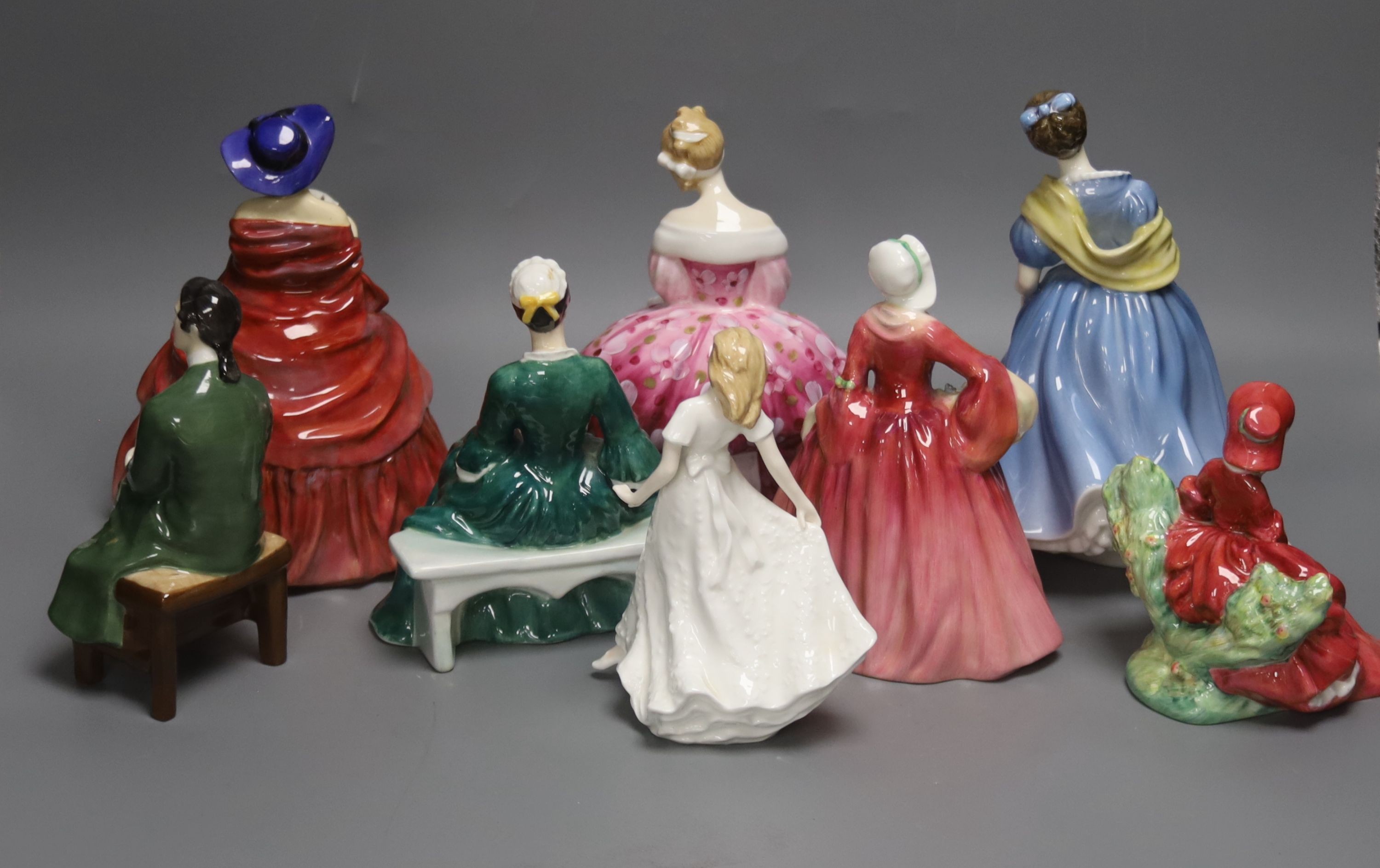 Eight various Royal Doulton figurines, tallest 22cm
